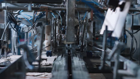 automated factory cardboard production at mechanical modern manufacture closeup