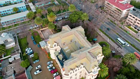 aerial dolly in of frech style carrasco palace surrounded by palm trees viã±a del mar, chile
