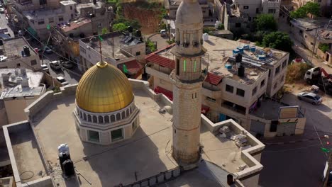 aerial view over golden dome mosque in palestine town biddu,near jerusalem