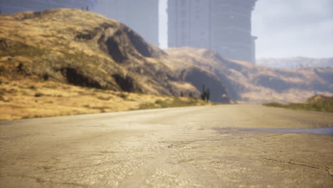 exploring a deserted road in a vast arid landscape with distant structures