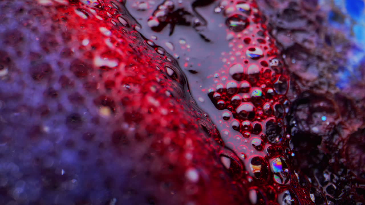 Abstract Macro Photography of Red and Purple Liquid with Bubbles