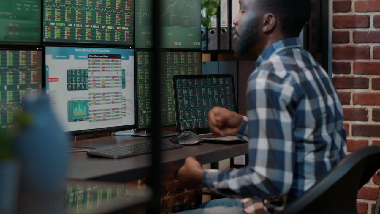 Hedge fund trader analyzing forex market numbers on laptop