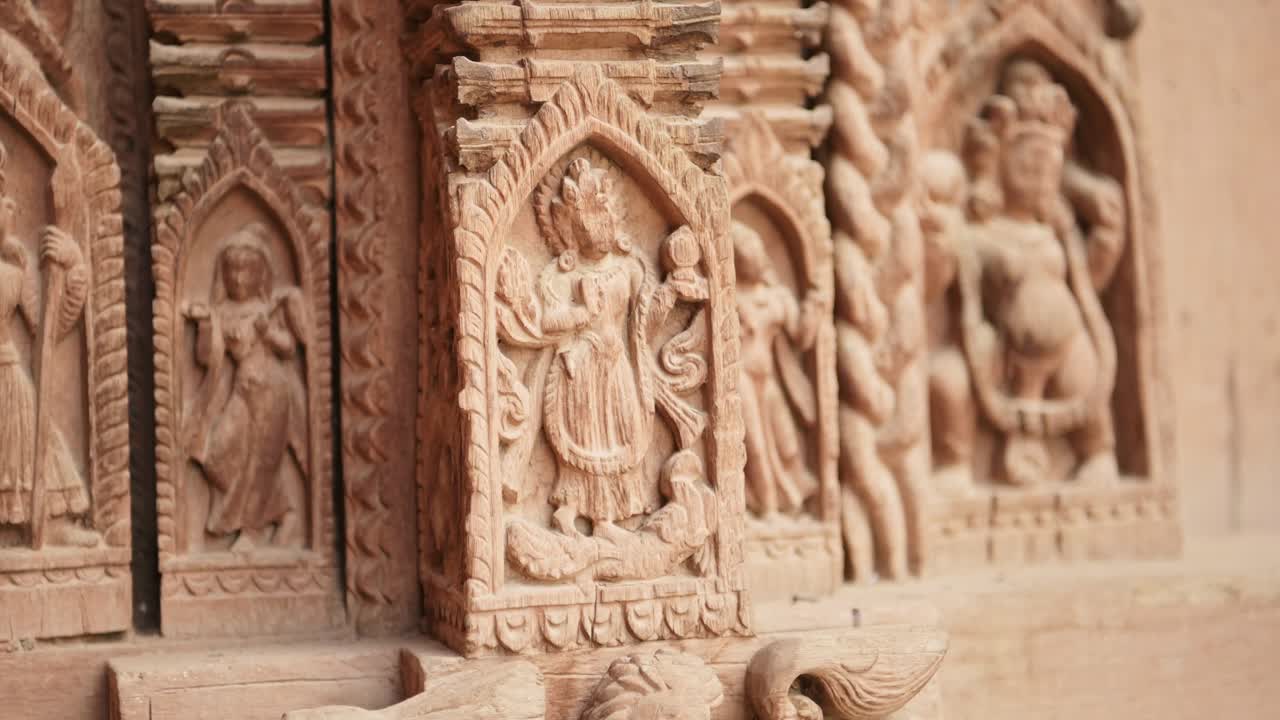 Intricate Wood Carving in Kathmandu, Carved Wooden Architectural Details in Amazing Elaborate Figures Carved into Wood in the Door of a Temple in Durbar Square in Nepal
