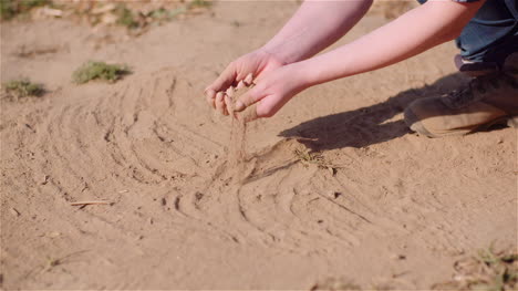 farmer touching dirt in hands pouring organic soil 1