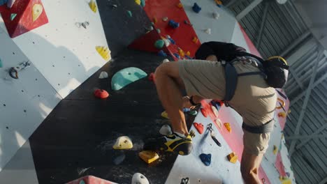 man rock climbing indoor