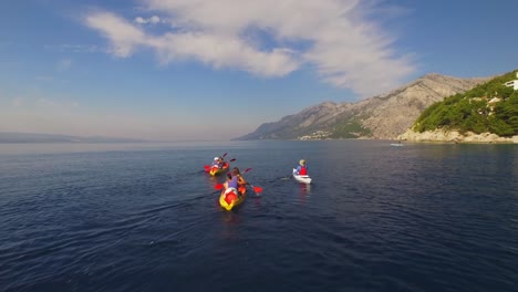 the group has fun in a canoe on the beautiful sea