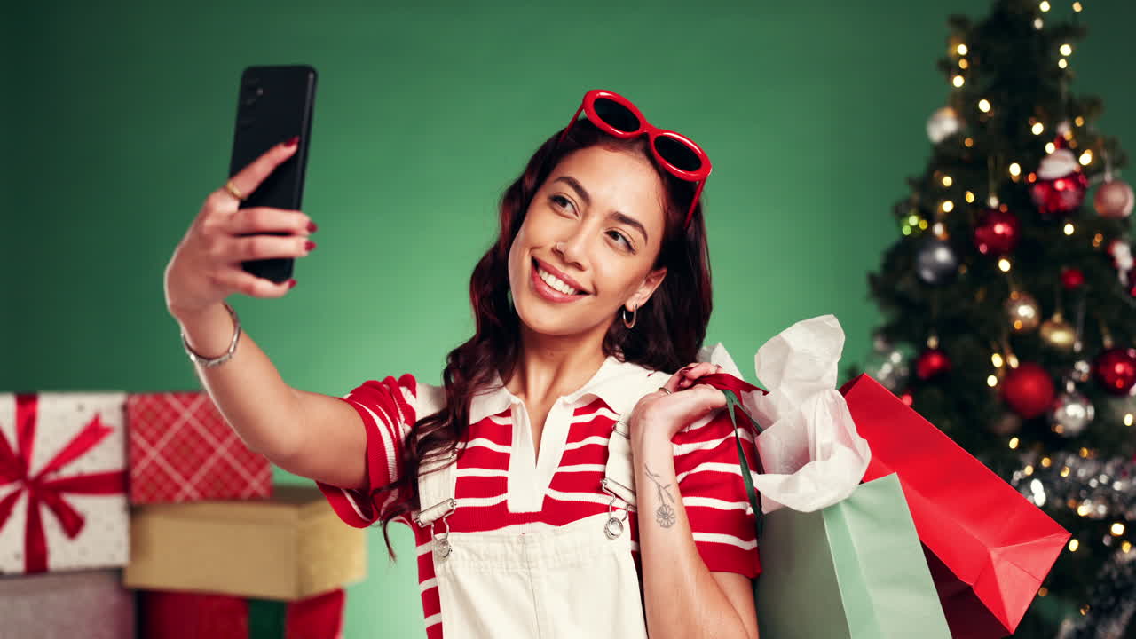 Woman taking a Christmas selfie after holiday shopping