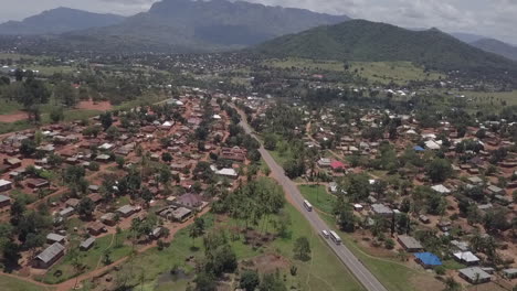 African-highway-traffic-enters-town-in-Malawi-near-misty-mountains