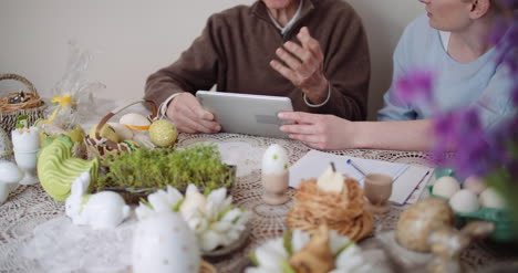 granddaughter with grandfather using digital tablet 5