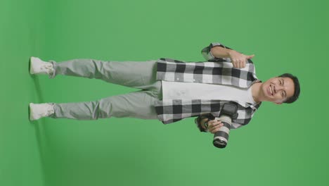 photographer with camera in a studio