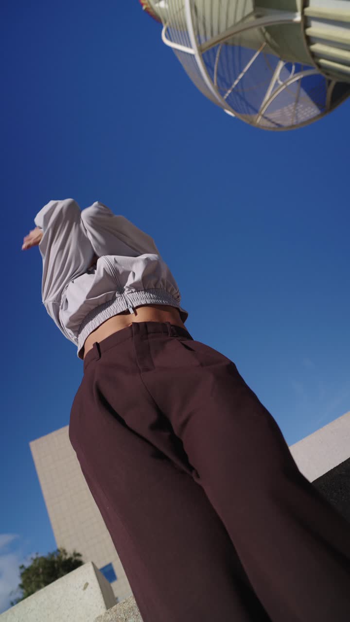 Young Woman Performing Dynamic Contemporary Dance in Urban Setting