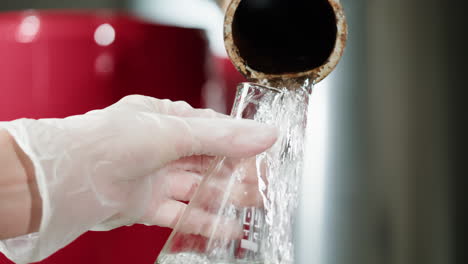 pouring water into a flask
