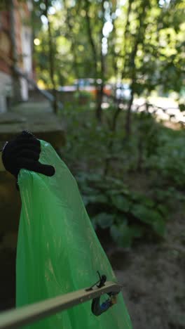 cleaning up trash with a grabber