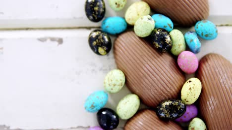 chocolate easter eggs on wooden plank