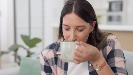 Phone,-coffee-and-laptop-with-a-woman-on-a-sofa-to