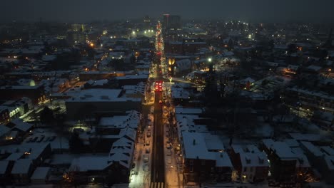 american city during winter with snow at night