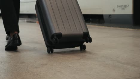 tourist man with suitcase baggage in spain, a traveler with luggage suit jacket on business street go to a hotel, business office, airport terminal, enjoying the vibrant atmosphere