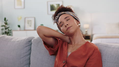 woman relaxing on couch, possibly with neck pain.