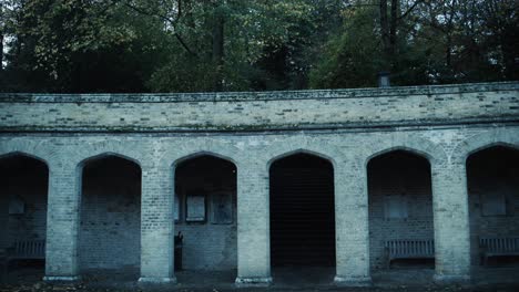 the archway entrance to a graveyard