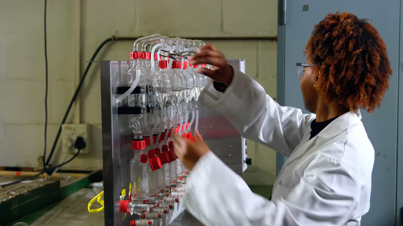 Female worker working in glass factory 4k