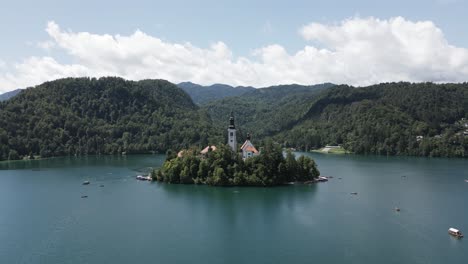 island on a lake with a big church