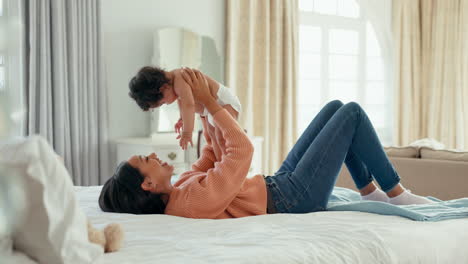 Relax,-happy-and-mother-with-baby-on-bed