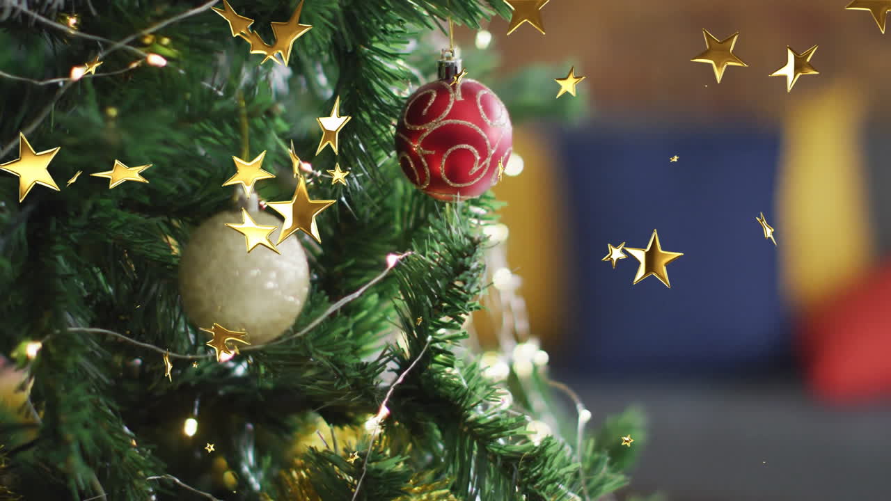 Decorating Christmas tree with ornaments and glowing stars in festive setting