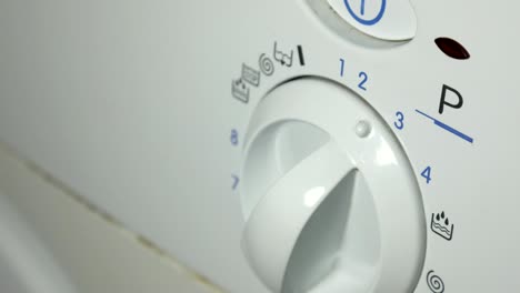 washing machine. setting program on a washing machine close up, broken.