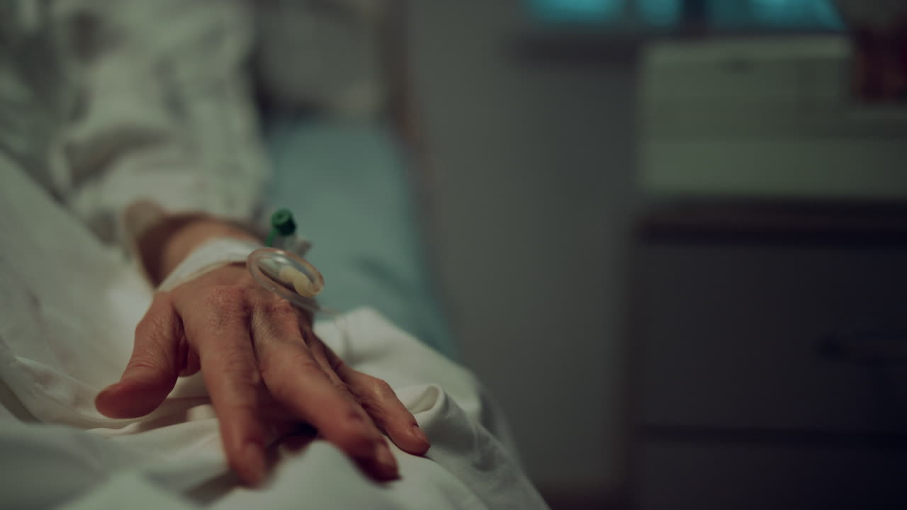 Closeup hand medical catheter in hospital ward. Clinic emergency care unit.