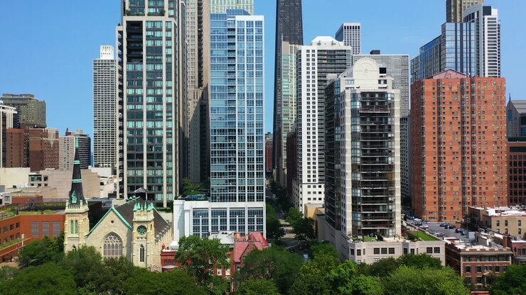 Aerial view rising from the Washington Square Park in front of the Rush and Division skyline, summer in Chicago, USA