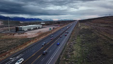 Incredible-Aerial-View-of-S-Redwood-Road-Street-and-Traffic-at-Bluffdale-Utah,-Lateral-Backward-Movement