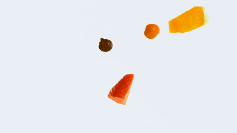 fruit salad falling against white background 4k