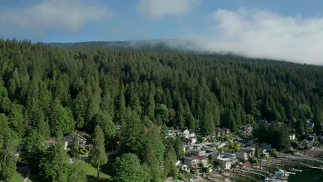 Aerial-view-of-mountainside-cottages-over-the-water