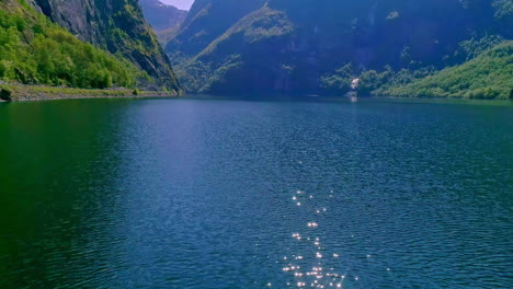 picturesque fjord in norway - aerial flyover the surface of the water