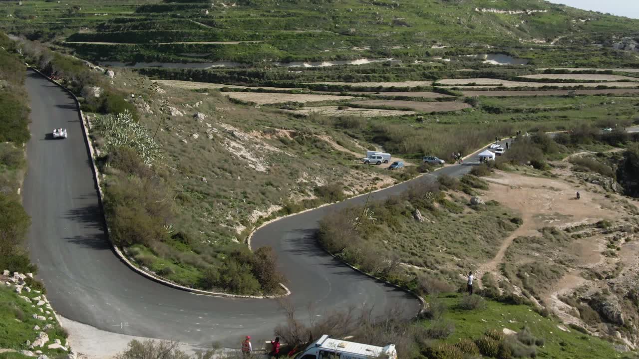 White Racing Car Drifting On The Curved Road Track Uphill - Aerial Shot