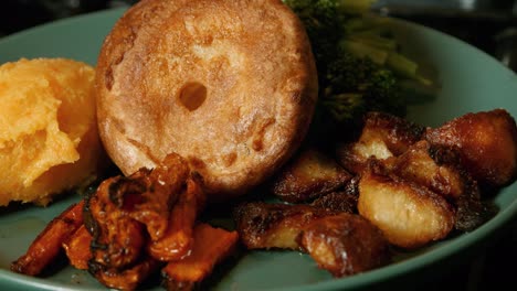 sunday roast dinner plate with roast potatoes, carrots, broccolli, suede mash and yorkshire pudding