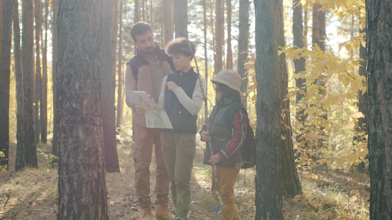 Family Hiking Trip in Autumn Forest