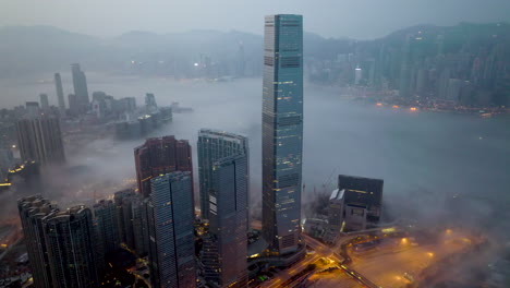 Coastal-fog-over-Victoria-Harbour,-downtown-Hong-Kong