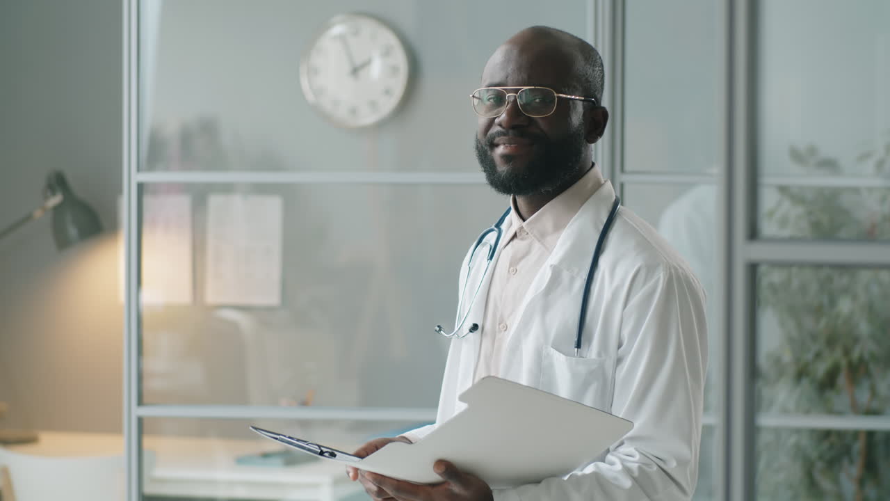 Portrait of African American Doctor at Work in Clinic