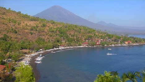 A-White-Boat-Pulls-Into-A-Harbor-In-Indonesia-1