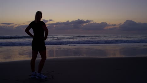 european girl jogging on beach for fat burning