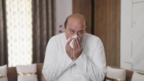 indian old man suffering from cold and cough