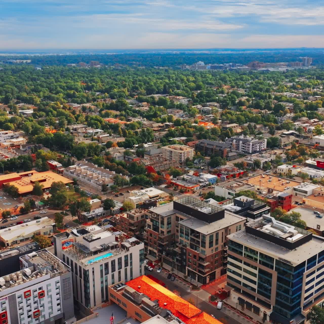 Bright colorful scenery of beautiful Denver, Colorado, USA on sunny daytime. Lots of green trees mingling with nice architecture. Top view