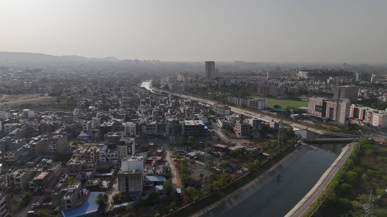 Golden sunlight casting soft shadows over Jaipur’s rooftops and winding lanes.