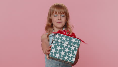 lovely smiling preteen child girl kid presenting birthday gift box offer wrapped present celebrating
