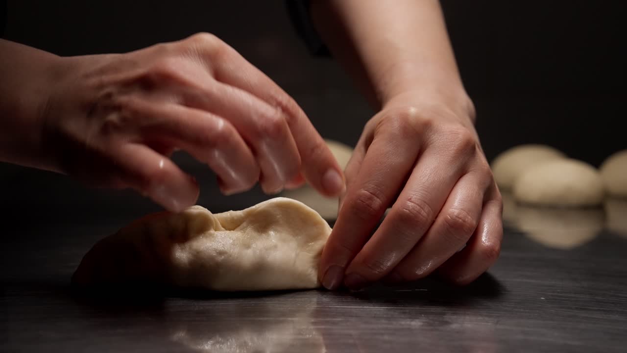 Close-up of Hands Shaping Dough for Pastry