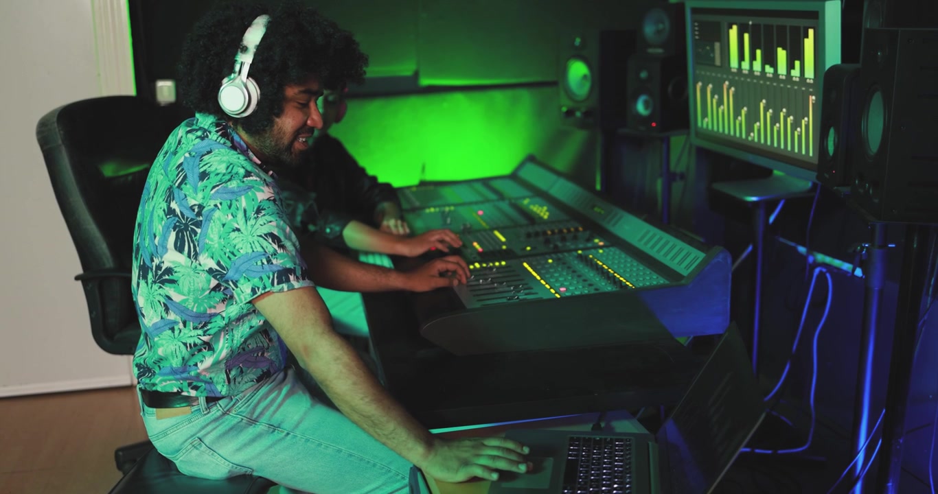 Music Producers Collaborating in a Vibrant Recording Studio