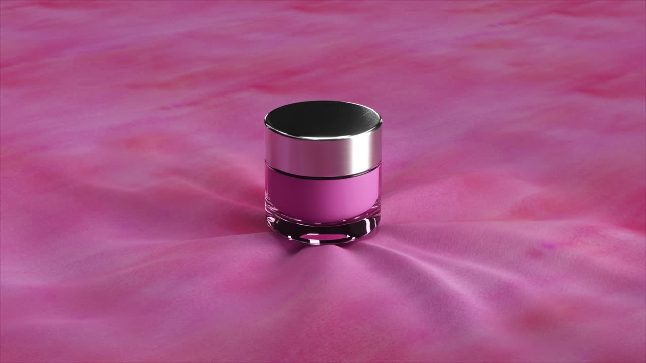 frasco de cosméticos rosado en tela