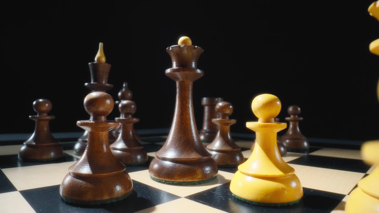 Dolly in macro shot of vintage chess pieces on a chessboard