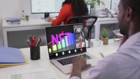 Video-of-african-american-man-having-nft-video-call-on-laptop-with-coworkers